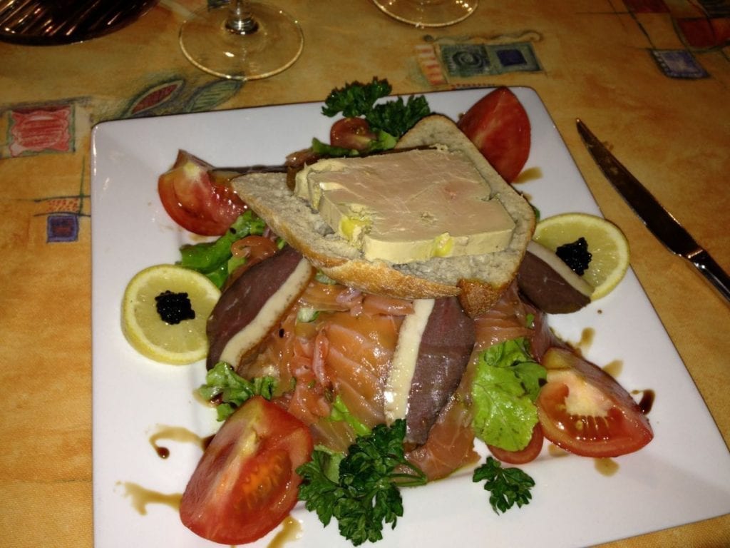 Gourmet dinner during a small group tour of France at the Hotel Cro-Magnon. 